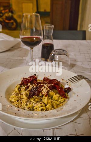 Close up of a typical dish, orecchiette with peperoni cruschi, in a restaurant in Matera Stock Photo