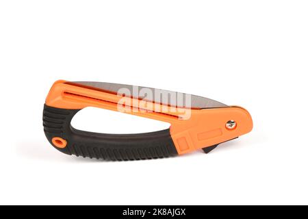Folding garden saw in the folded state isolated on a white background, pocket saw. High resolution photo. Full depth of field. Stock Photo