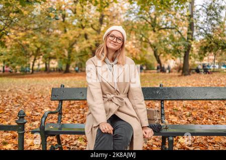 fashion redhead Girl in Knitted Hat and galsses on grey background Stock  Photo - Alamy