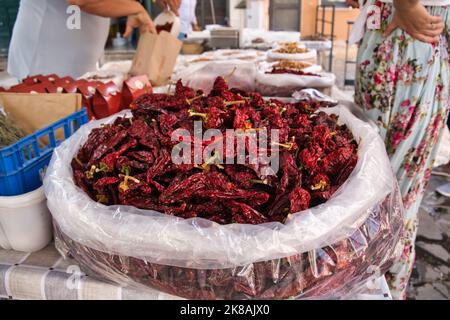 "Peperoni cruschi", a typical ingredient of the local cuisine, at the open air market in Matera Stock Photo