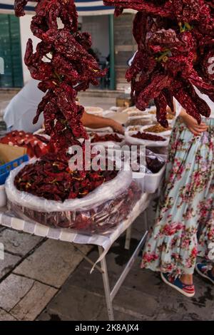 "Peperoni cruschi", a typical ingredient of the local cuisine, at the open air market in Matera Stock Photo