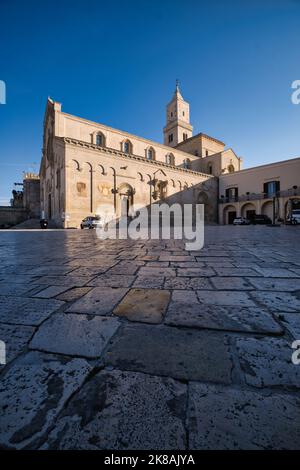 View of the cathedral of Matera at the end of the pavement of the Duomo square Stock Photo