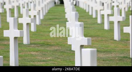 Colleville-sur-Mer, FRA, France - August 21, 2022: American Military Cemetery and many white crosses on the graves of the soldiers Stock Photo