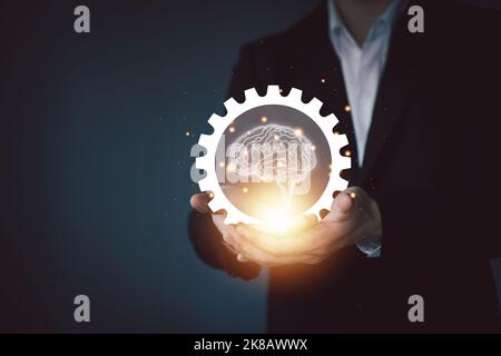 Gears with brain and businessman. Successful business and process management. Workflow automation diagram. Planning growth strategy. Stock Photo