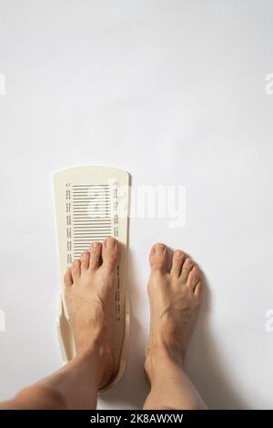 stopwatch for measuring leg length on an isolated background, plastic leg length meter Stock Photo