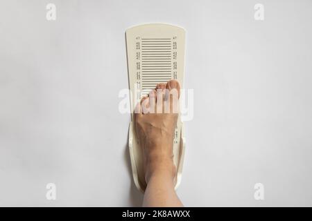 stopwatch for measuring leg length on an isolated background, plastic leg length meter Stock Photo