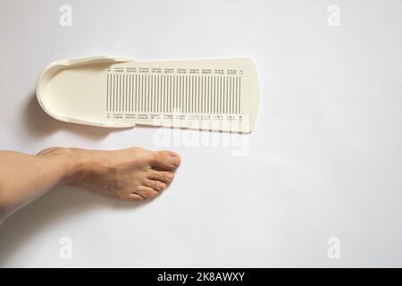 stopwatch for measuring leg length on an isolated background, plastic leg length meter Stock Photo