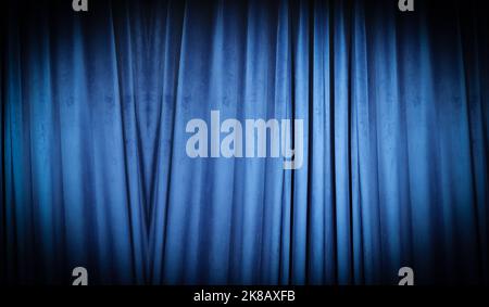 Blue curtain fabric making a dark banner background. Stock Photo