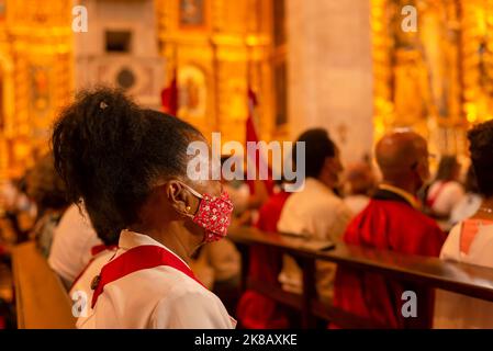 Salvador, Bahia, Brazil - June 16, 2022; Catholics and priests praying inside the basilica Cathedral at Largo do Pelourinho in Salvador, Brazil. Stock Photo