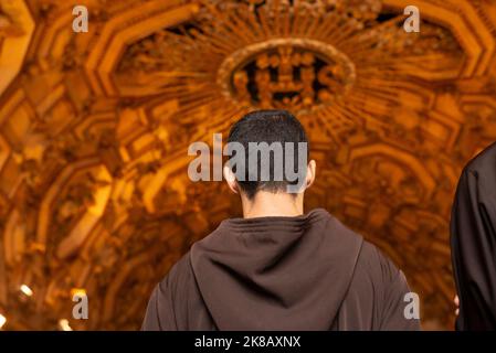 Salvador, Bahia, Brazil - June 16, 2022; Catholics and priests praying inside the basilica Cathedral at Largo do Pelourinho in Salvador, Brazil. Stock Photo