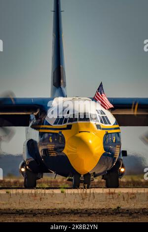 The Marine Corps C-130 Hercules, maintenance and support aircraft for the US Navy Blue Angels, known as Fat Albert, flies the American flag at the 202 Stock Photo