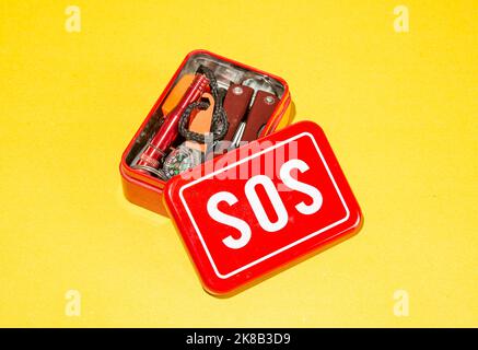 SOS emergency life saving kit isolated on yellow banner background. Stock Photo
