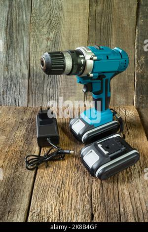 Mobile equipment on the background of boards. A tool for carpentry close-up Stock Photo