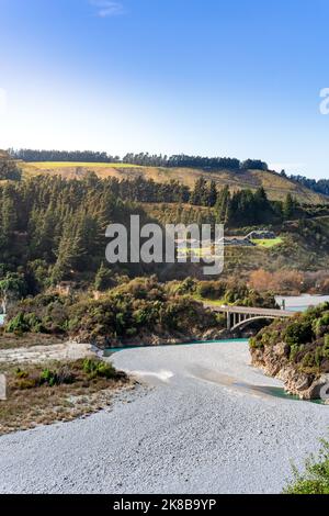 Stunning view of Rakaia Gorge Bridge and Rakaia River in inland Canterbury on New Zealand's South Island. Mountains in the background. Stock Photo
