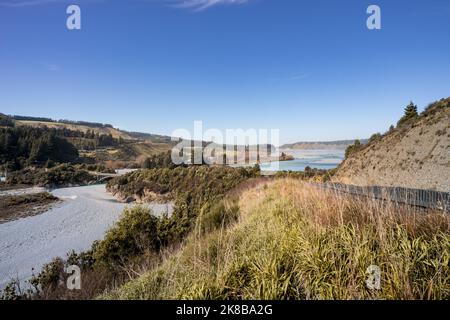 Stunning view of Rakaia Gorge Bridge and Rakaia River in inland Canterbury on New Zealand's South Island. Mountains in the background. Stock Photo