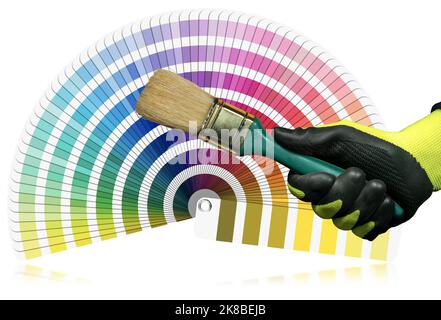 Manual worker with work gloves holding a used paintbrush with green handle, pantone color swatches on background. Isolated on white background. Stock Photo