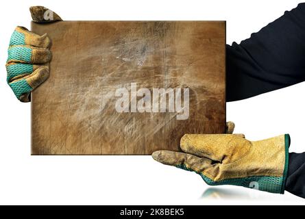 Manual worker with protective work gloves holding a rusty metal plate, isolated on white background with copy space. Stock Photo