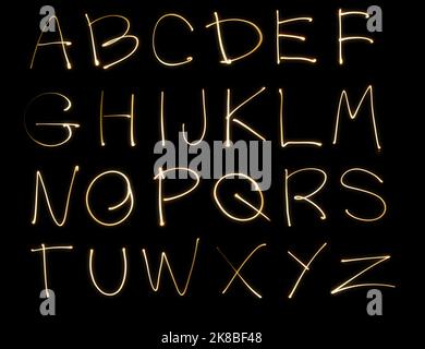 Neon handwritten doodle lettering alphabet design elements glowing light. Stock Photo