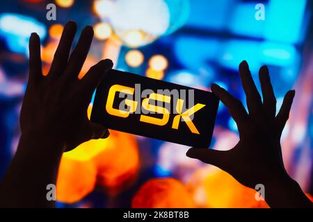 In this photo illustration, the GlaxoSmithKline (GSK) logo is displayed on a smartphone screen. Stock Photo