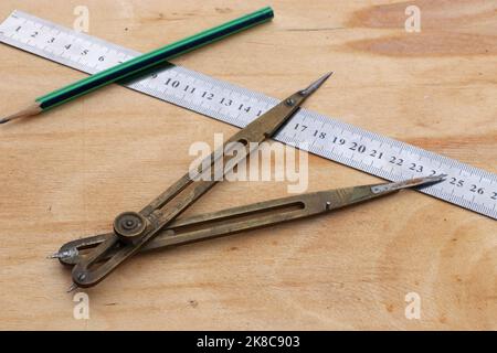 Old bronze divider for carpentry. Old carpentry's compass. Carpentry's tool. Stock Photo