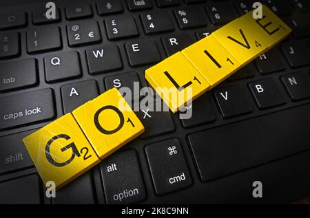 Software projects, Go-Live at the right time - Going Live spelt out in Monopoly Letters on dictionary definition Stock Photo