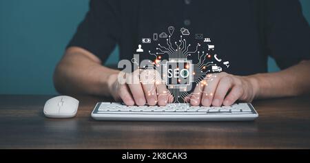 Man using Computer keyboard to searching on internet, Search Engine Optimization(SEO) Technology for Online Marketing, Web Page, Website, E-commerce c Stock Photo