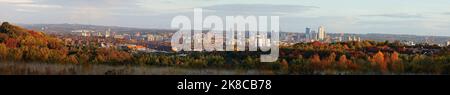 A view across Leeds City Centre on an Autumn day from Middleton Park Woods Stock Photo