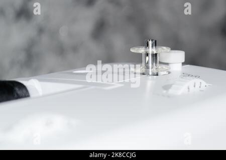 Sewing machine. Bobbin on a sewing machine. Close-up. Stock Photo