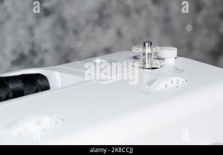 Bobbin on a sewing machine.Close-up. Stock Photo