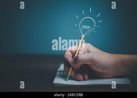 Hand holding a pen writing down on a notebook and document with copy space. idea, recording concept Stock Photo