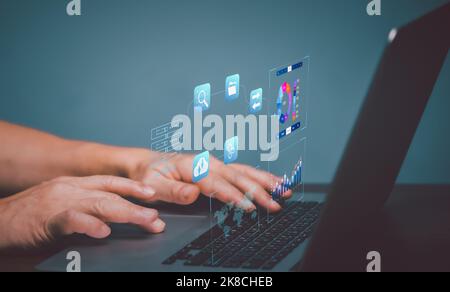 Analyst working with Business Analytics and Data Management System on computer, make a report with KPI and metrics connected to database. Corporate st Stock Photo