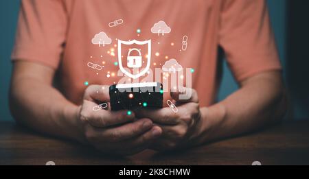 Cyber security connection shield technologies background, Human finger touching on mobile phone with global network linking technology. Stock Photo