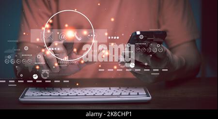 Contact us or Customer support hotline people connect. Businessman using a Mobile phone and touching on virtual screen contact icons ,mail, email, liv Stock Photo