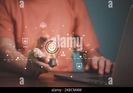 Man Hand holding Light bulb Global Internet connection. Business global internet connection application technology and digital marketing, Financial an Stock Photo