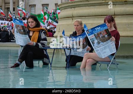 London, UK, 22nd October, 2022. Animal Rebellion activists stage a demonstration in the Trafalgar Square fountain with a mock Guardian newspaper and tofu, following comments made by former Home Secretary Suella Braverman criticising protesters. The group urges government action to transition from animal farming towards a plant-based food system. Credit: Eleventh Hour Photography/Alamy Live News Stock Photo