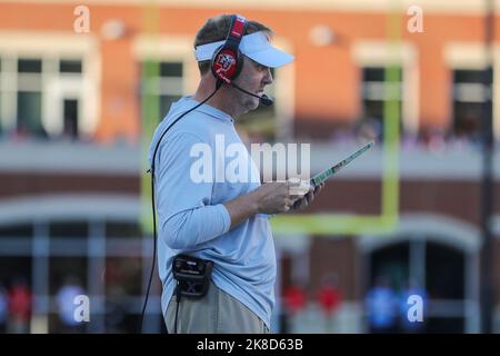 Lynchburg, Virginia, USA. 22nd Oct, 2022. Liberty Flames head coach Hugh Freeze reading his play sheet during the NCAA football game between the Brigham Young Cougars and the Liberty Flames at Williams Stadium in Lynchburg, Virginia. Greg Atkins/CSM/Alamy Live News Stock Photo