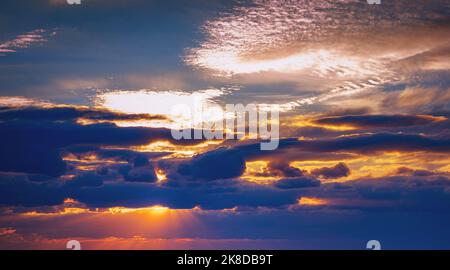sunset on cloudy sky at blue hour Stock Photo