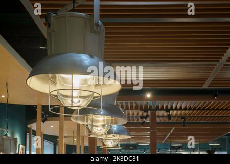 classic vintage high bay hanging lamp lighting  at the ceiling for light decoration in the coffee shop or restaurant. Stock Photo