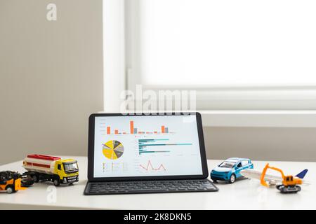 Tablet computer with different types of toy transport. auto center Stock Photo
