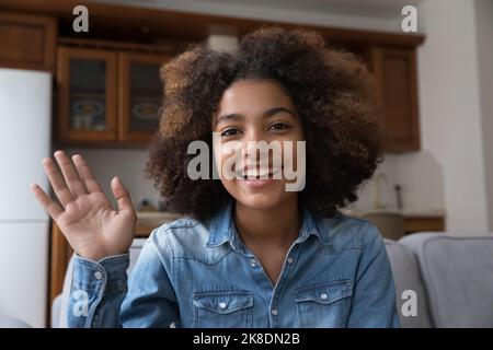 African teenager girl looks at camera start videocall Stock Photo