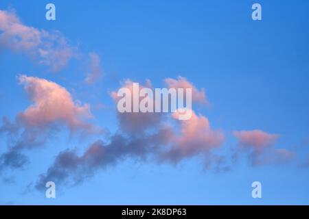 Fluffy clouds with colorful light in the evening Stock Photo