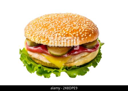 Grilled cheeseburger with pickles and sauces in a white bun with sesame seeds on a lettuce leaf. Street food Stock Photo
