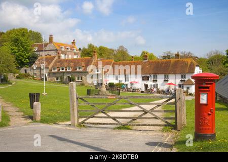 post box near the the tiger inn on the green in east dean village east sussex Stock Photo