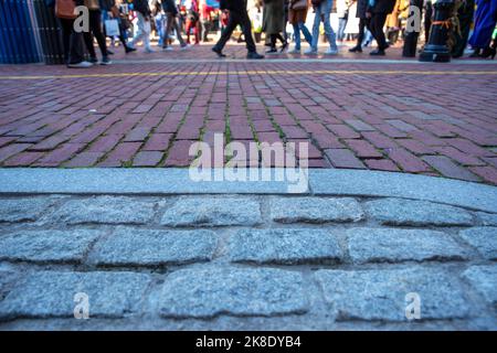 Cobblestone and brick street on Freedom Trail Boston with pedestrians Stock Photo