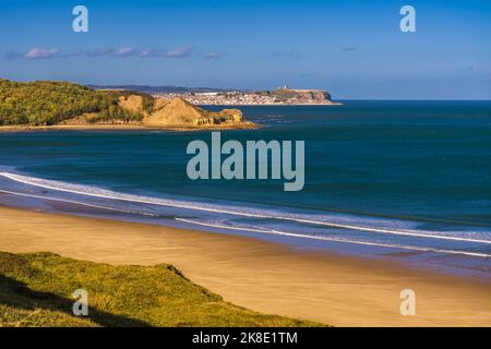View from Cayton Bay towards Knipe Point and then Scarborough in the distance. Stock Photo