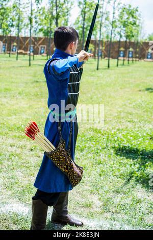 Old style wooden arrows in the case of an archer Stock Photo