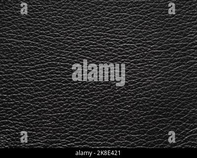 Luxury black leather texture sample. Background with copy space, top view. Genuine leather pattern in dark tone. Faux eco leather. Backdrop textured Stock Photo