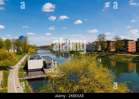 Boathouse on the Danube, river, flowing water, jetty, closed sunshades, left Neu-Ulm, path, Ulm, Baden-Wuerttemberg, Germany Stock Photo