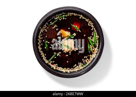 Japanese miso soup in dashi stock with miso paste, tofu and green onions garnished with sesame Stock Photo