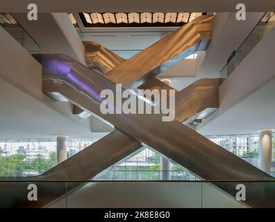 Bangkok, Thailand - Sep 30, 2022 : Interior side view of complexity multiple modern escalators (Crisscross escalators). Modern architecture of large b Stock Photo